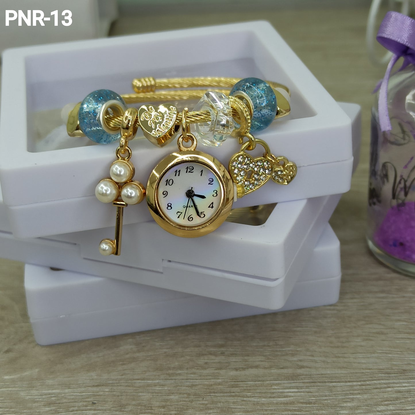 PNR RELOJ PULSERA TIPO PANDORA DORADO