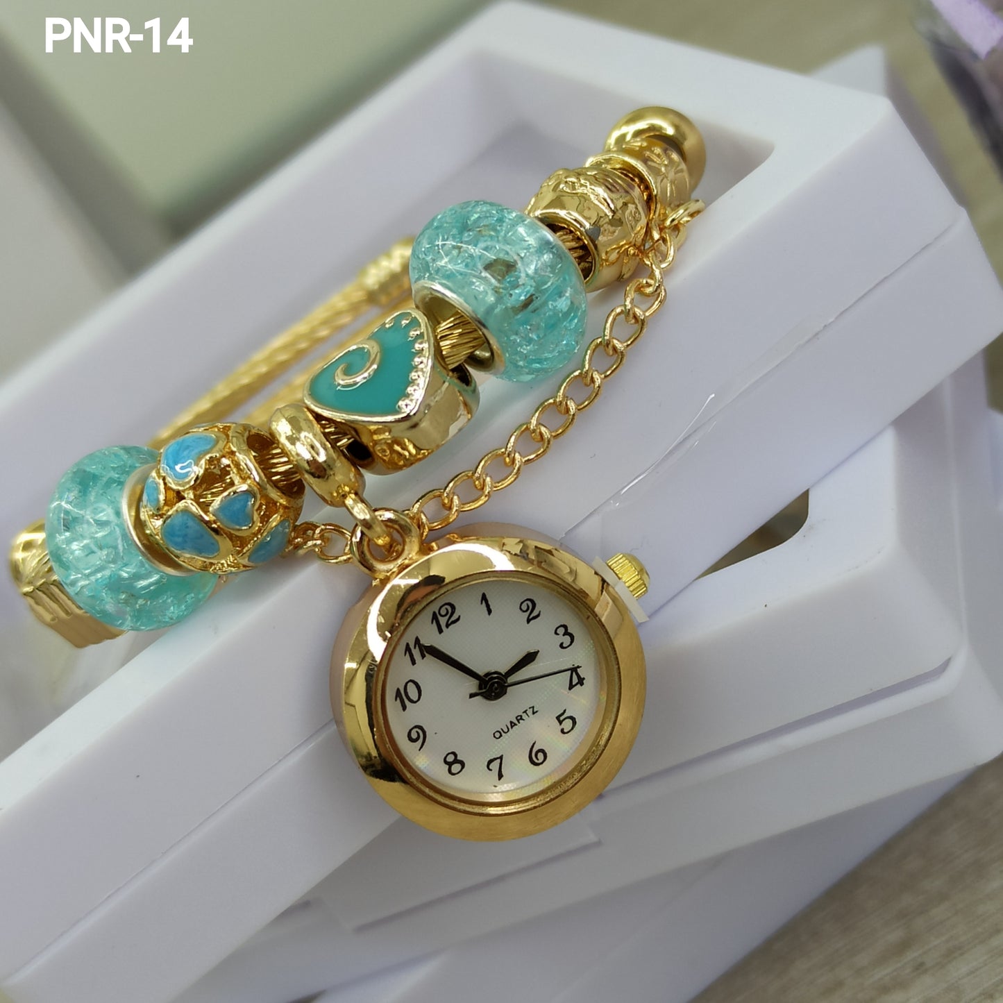 PNR RELOJ PULSERA TIPO PANDORA DORADO