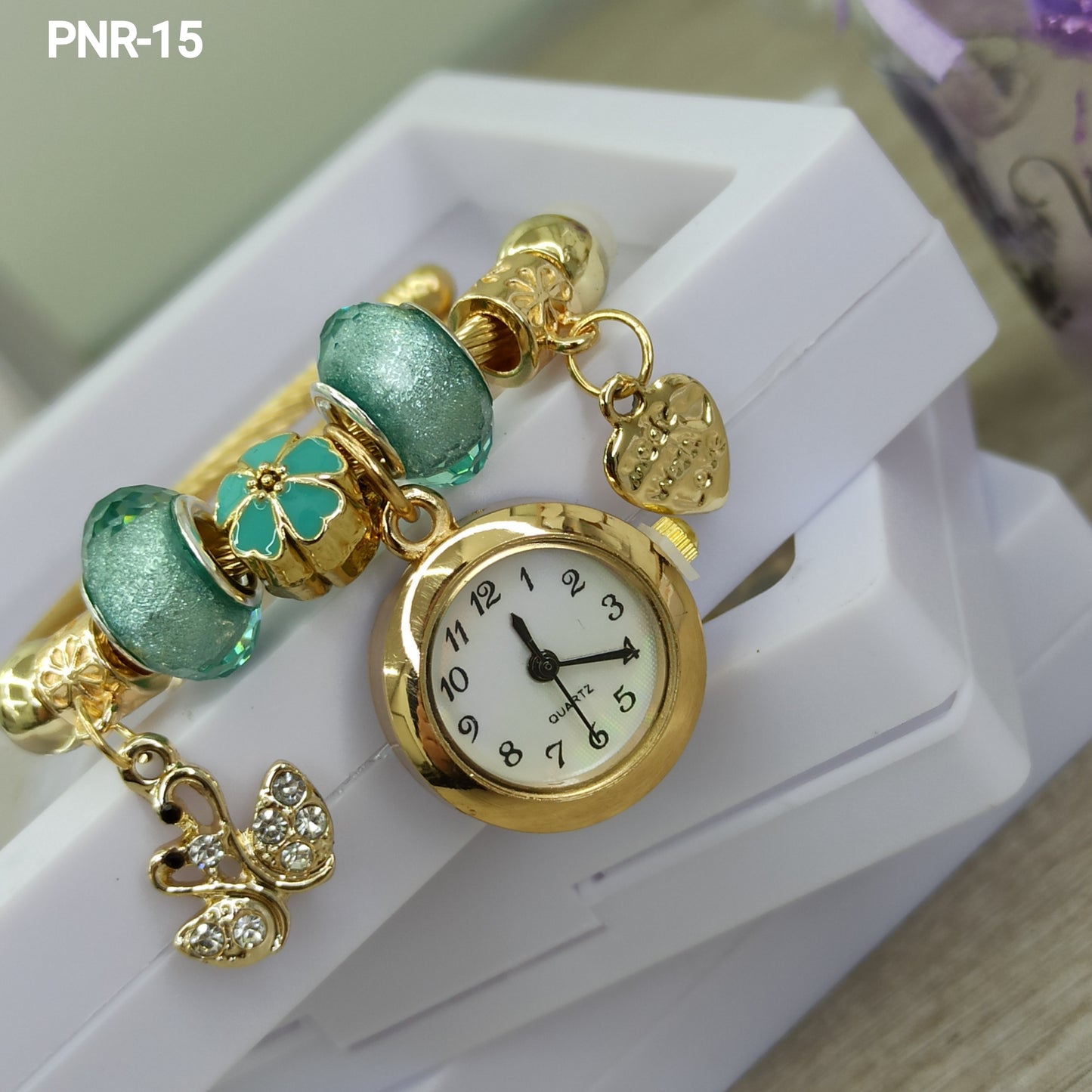 PNR RELOJ PULSERA TIPO PANDORA DORADO