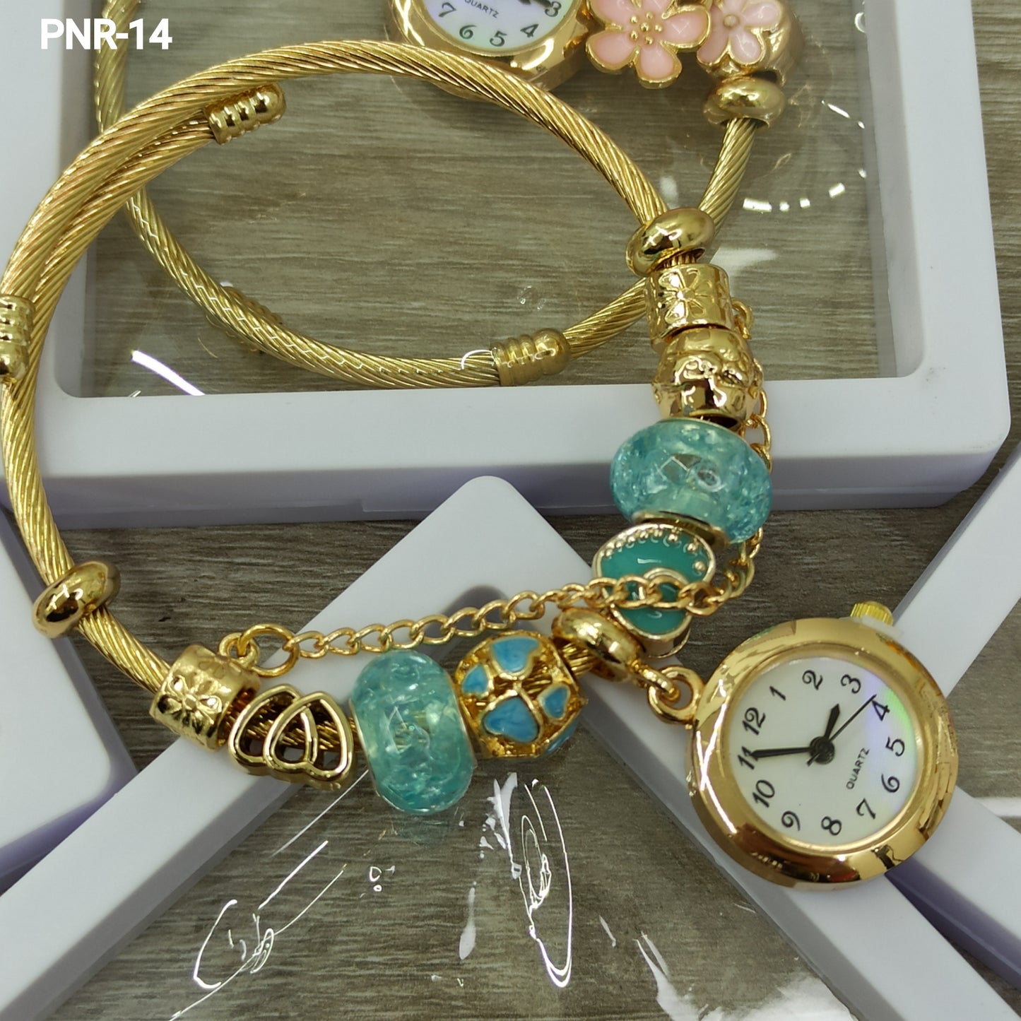 PNR RELOJ PULSERA TIPO PANDORA DORADO