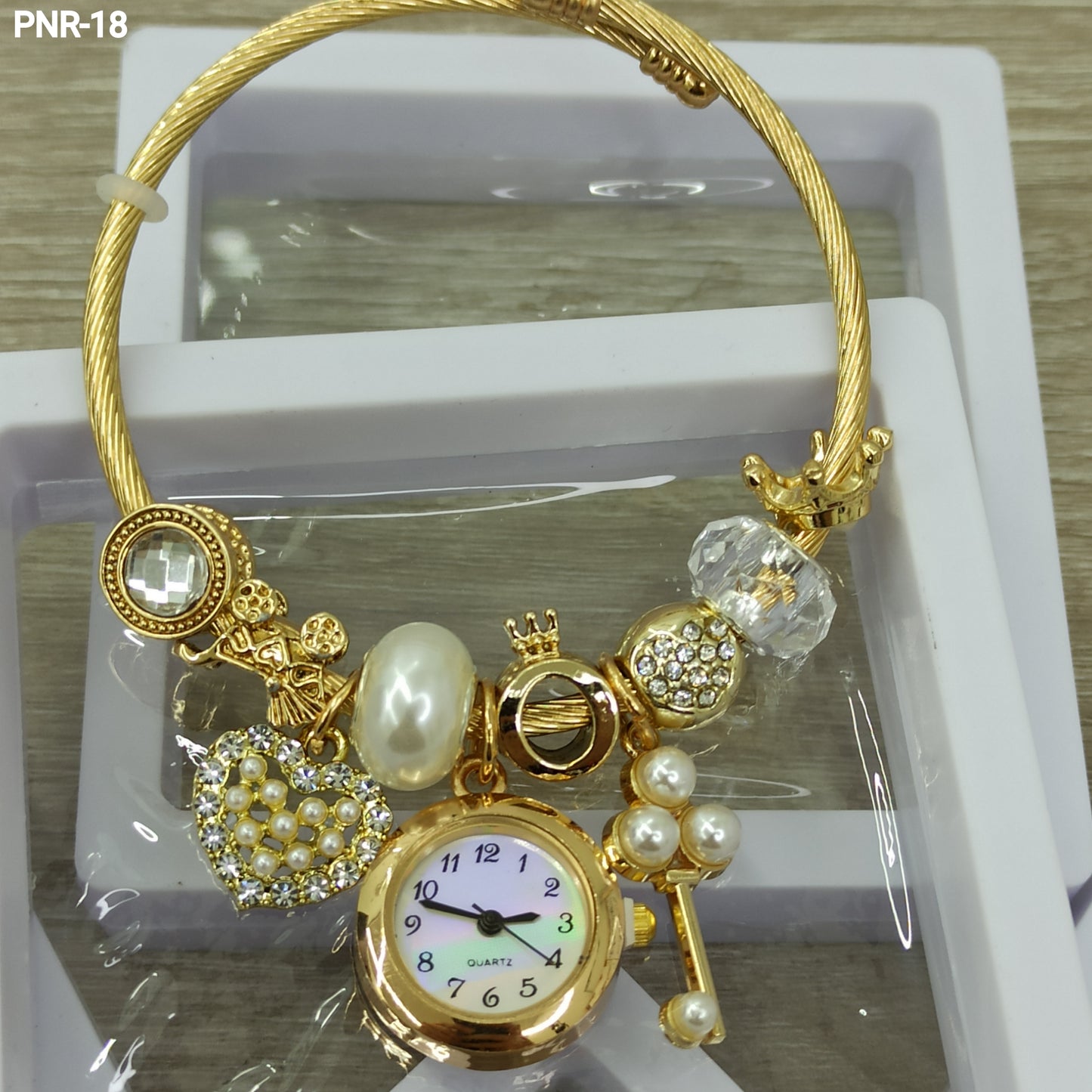 PNR RELOJ PULSERA TIPO PANDORA DORADO